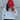 Person wearing a white sweatshirt and red cap with 'LINCOLN Ladies' text against a gray wall.
