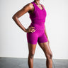 Person wearing a purple athletic outfit on a plain background