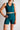 Person wearing a teal athletic outfit on a plain background