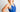 Woman wearing a blue athletic outfit against a plain background