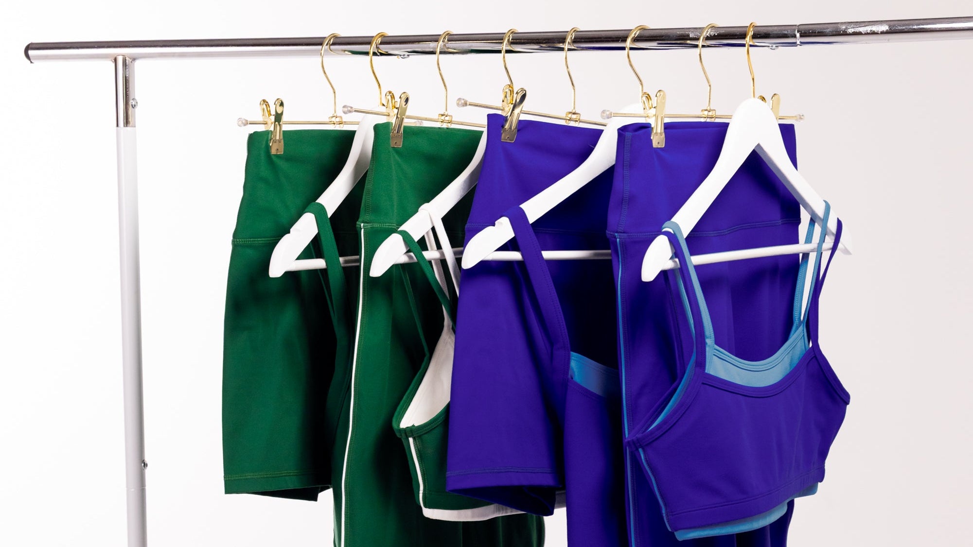 rack of green and blue athletic apparel