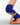 A close-up of a person in royal blue high-waisted yoga pants performing a yoga pose on a light gray mat against a white studio background.